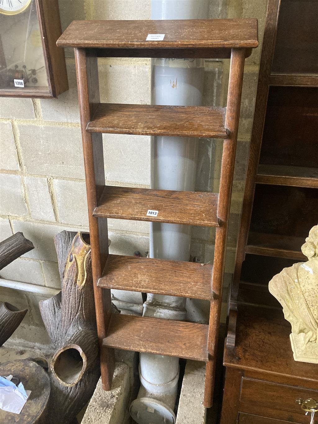 A four tread oak ladder, width 42cm, height 130cm